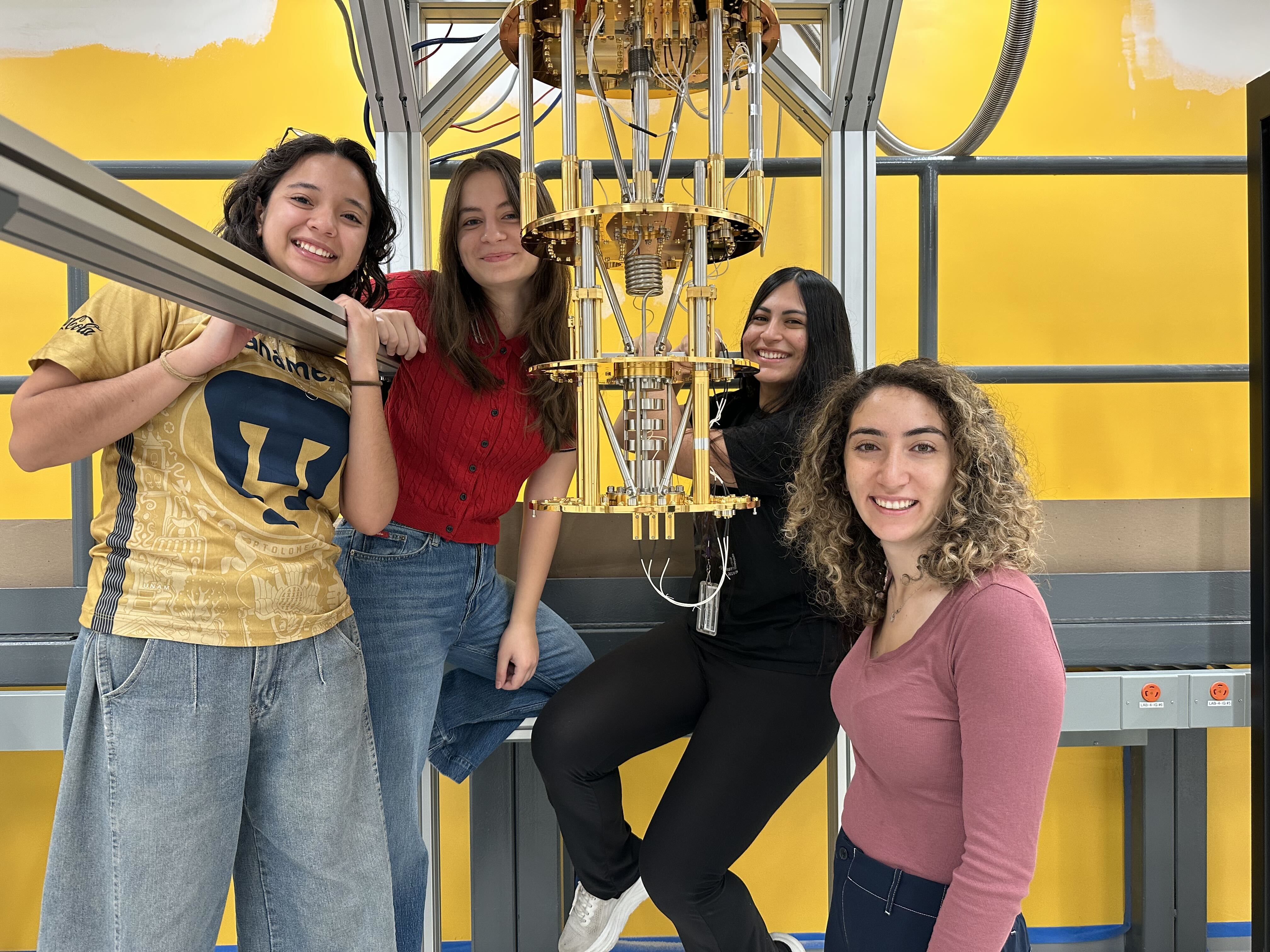 Four ALMA Lab members gathered around the open BF-Roebling dilution refrigerator.