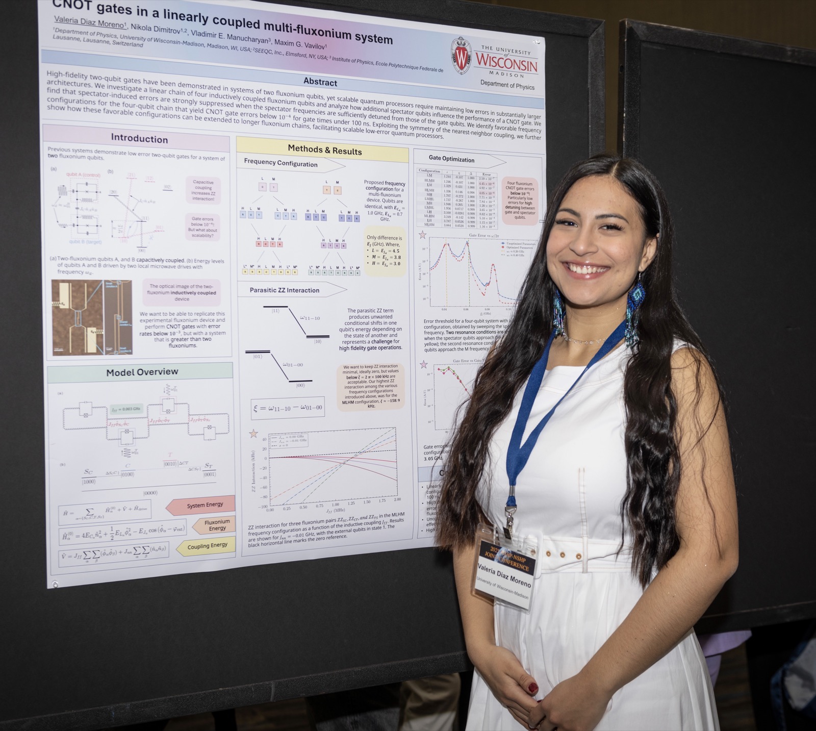 Valeria Diaz Moreno beside her poster at the Quantum Device Design Workshop